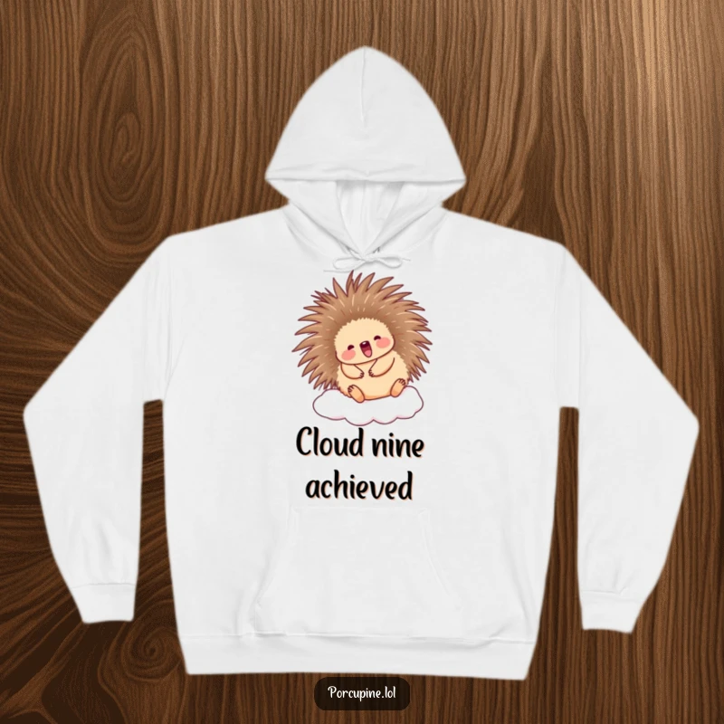 Funny Porcupine Hoodie: A cute porcupine happily bouncing on a cloud, designed for ultimate cozy happiness and laughter.