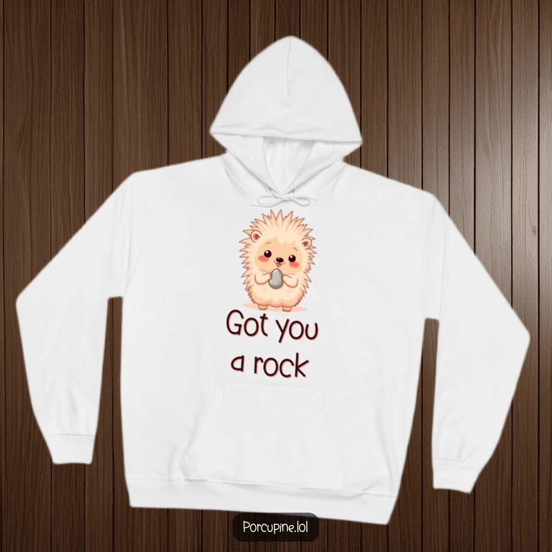 Funny hoodie featuring a porcupine joyfully presenting a single, shiny pebble, embodying thoughtful generosity and happiness.