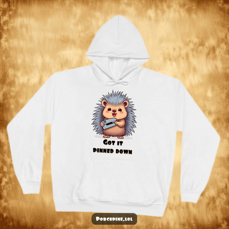 Funny hoodie featuring a porcupine with a triumphant stance, holding a miniature stapler aloft.