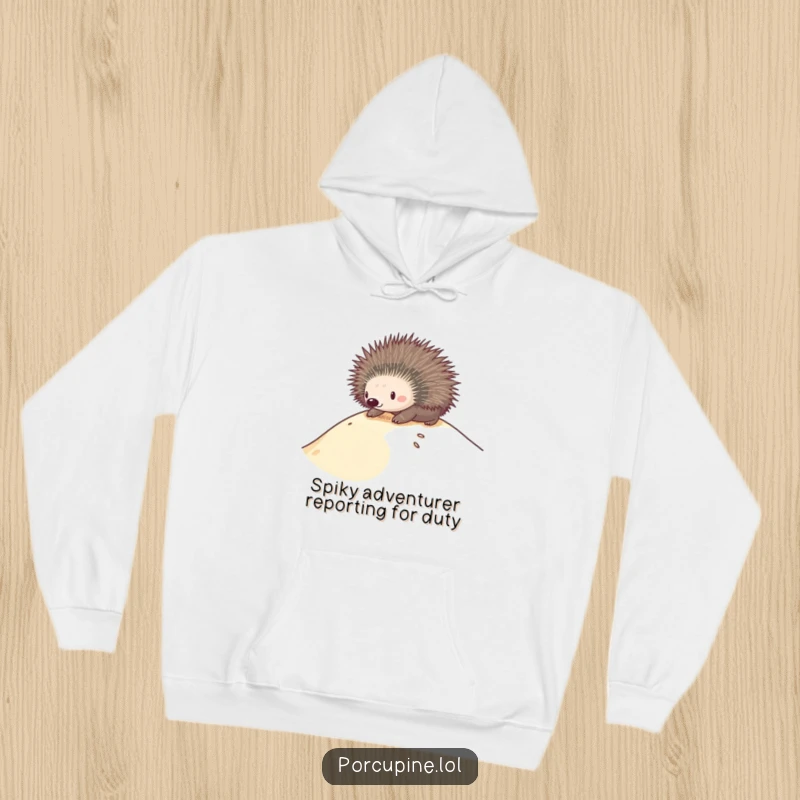 Funny hoodie showing a porcupine in mid-slide down a sandy dune, radiating happiness and a love for adventure.