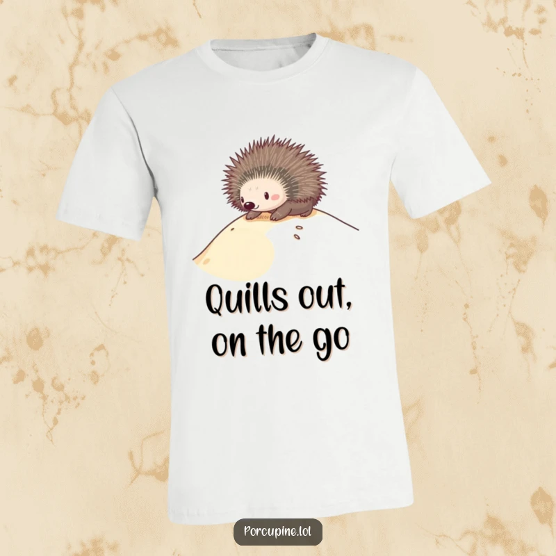 Funny T-shirt with a porcupine gleefully sliding down a sand dune, depicting pure joy and adventurous spirit.